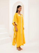 Kaftan adorned with intricate ivory thread embroidery