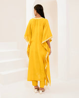 Kaftan adorned with intricate ivory thread embroidery