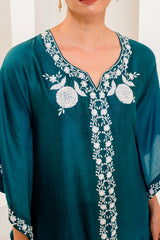 Teal blue kaftan adorned with intricate ivory thread embroidery