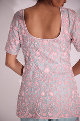 Elegantly embroidered set features floral motifs in resham aari , sequin, cut dana and bead work