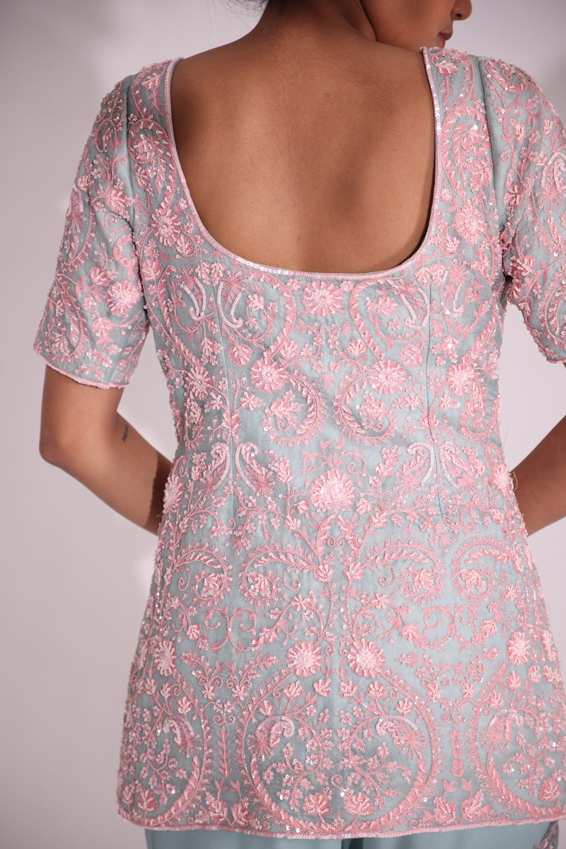 Elegantly embroidered set features floral motifs in resham aari , sequin, cut dana and bead work